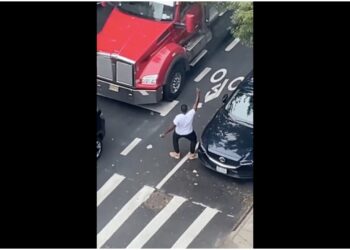 dancing man stops traffic New York honking truck driver